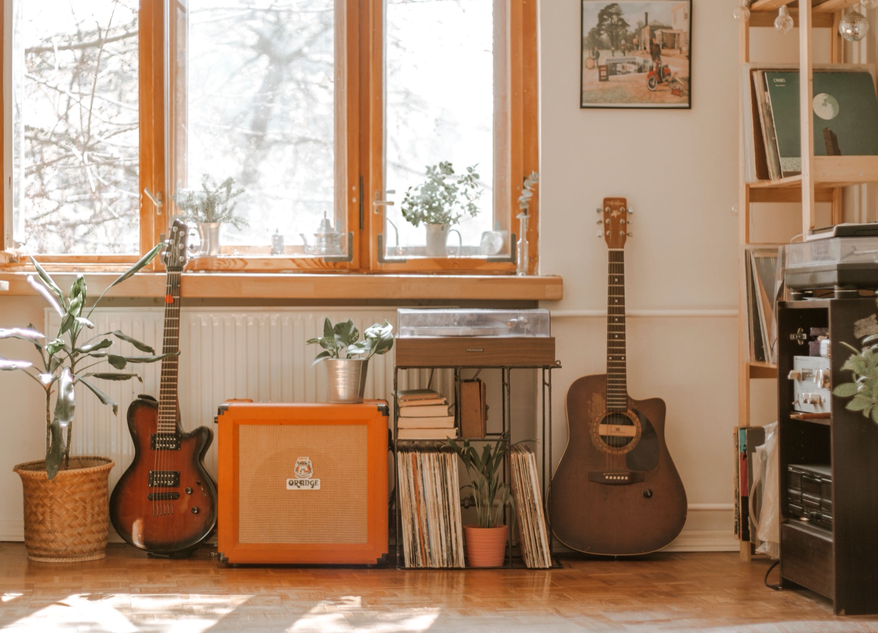 Two guitars in a warm home music room